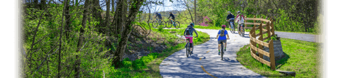 Family with kids biking on bike trail in Bella Vista, Arkansas